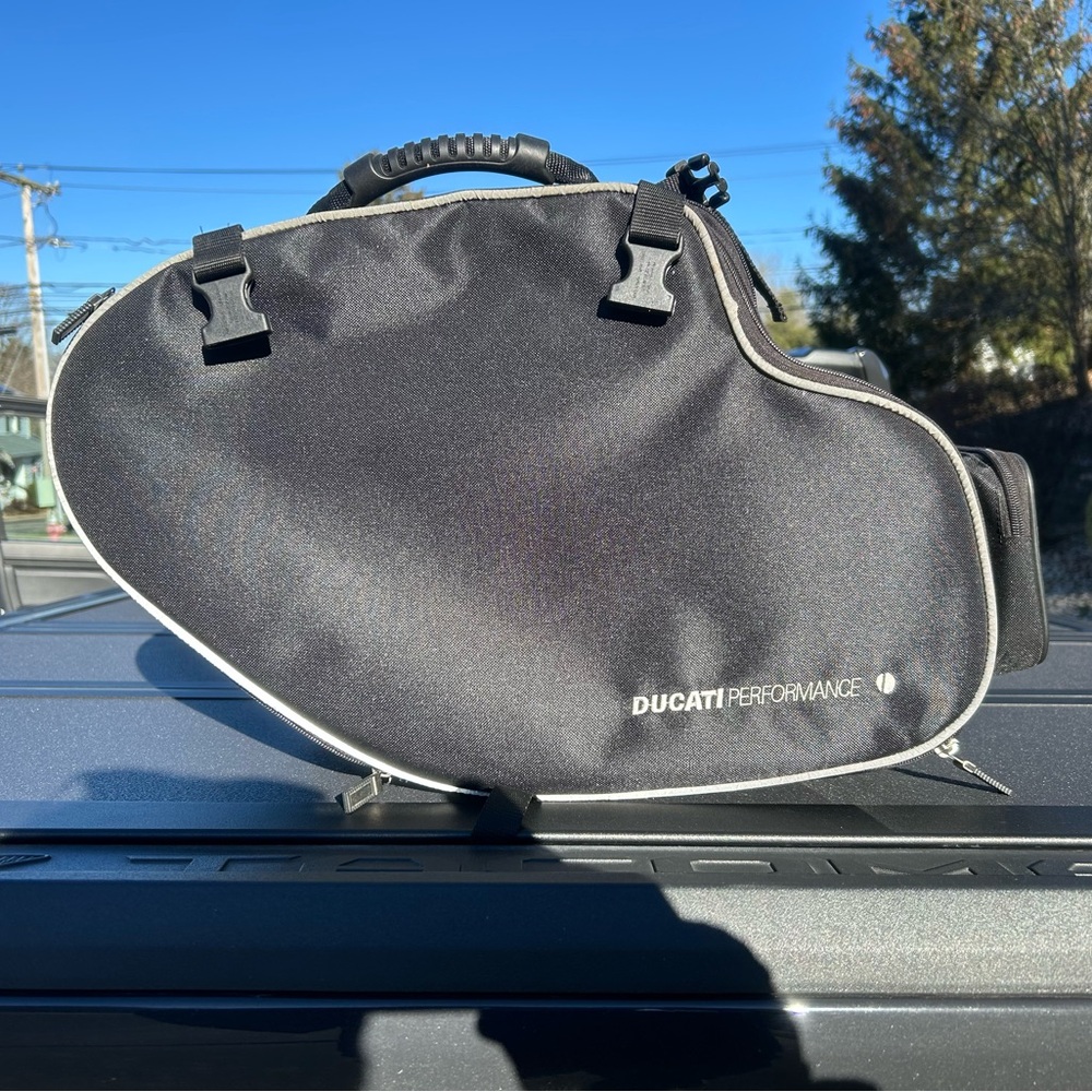Ducati Performance Black semi rigid saddlebag. With connection bar.